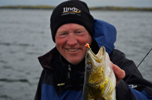 image of jeff sundin with walleye caught during cold weather